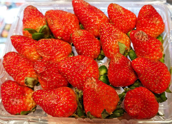 Bruised Strawberries In Container