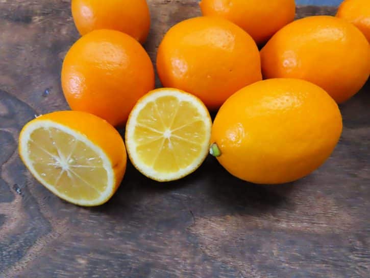 Meyer Lemons Whole And Cut On Table