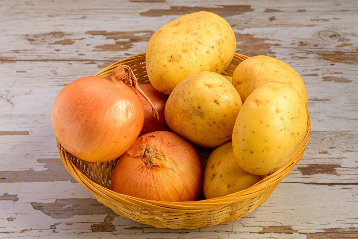 Onions And Potatoes In Basket
