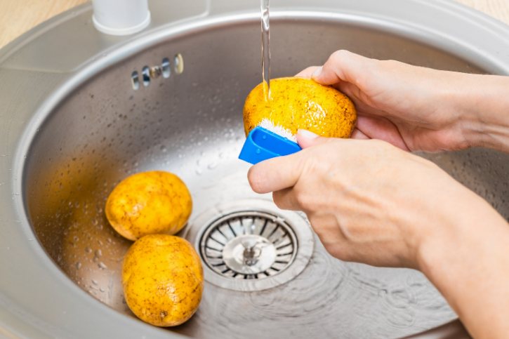Washing Potatoes In Sink