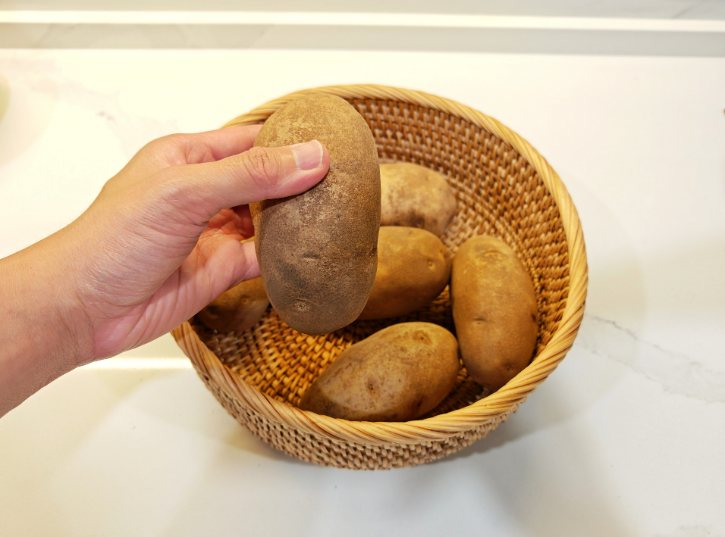 Checking Potato In Basket