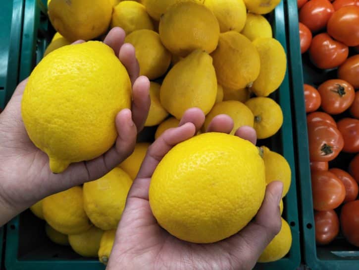 Comparing Lemon Weight By Hand