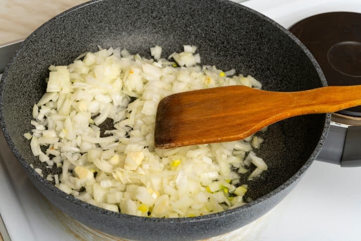 Diced Yellow Onions Cooking In Pan