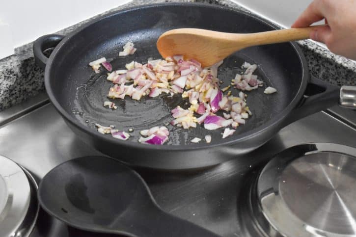 Diced Red Onions Cooking In Pan