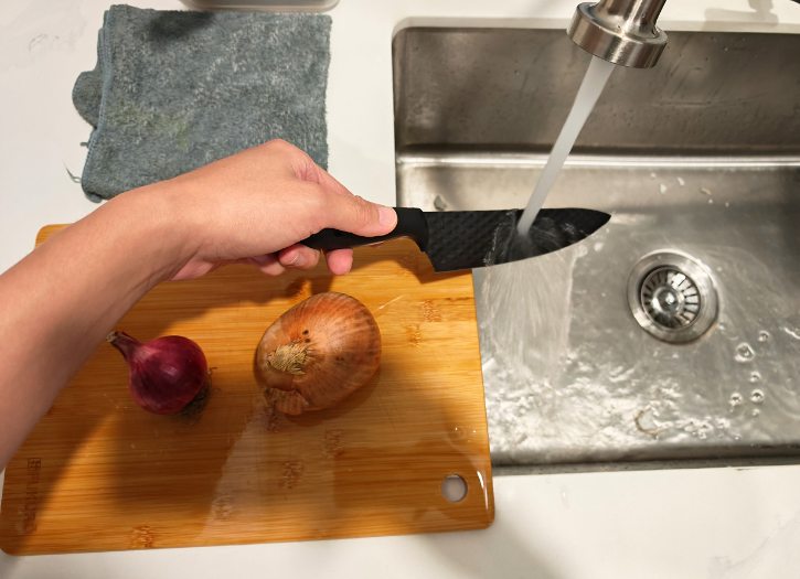 Wet Knife Under Running Water