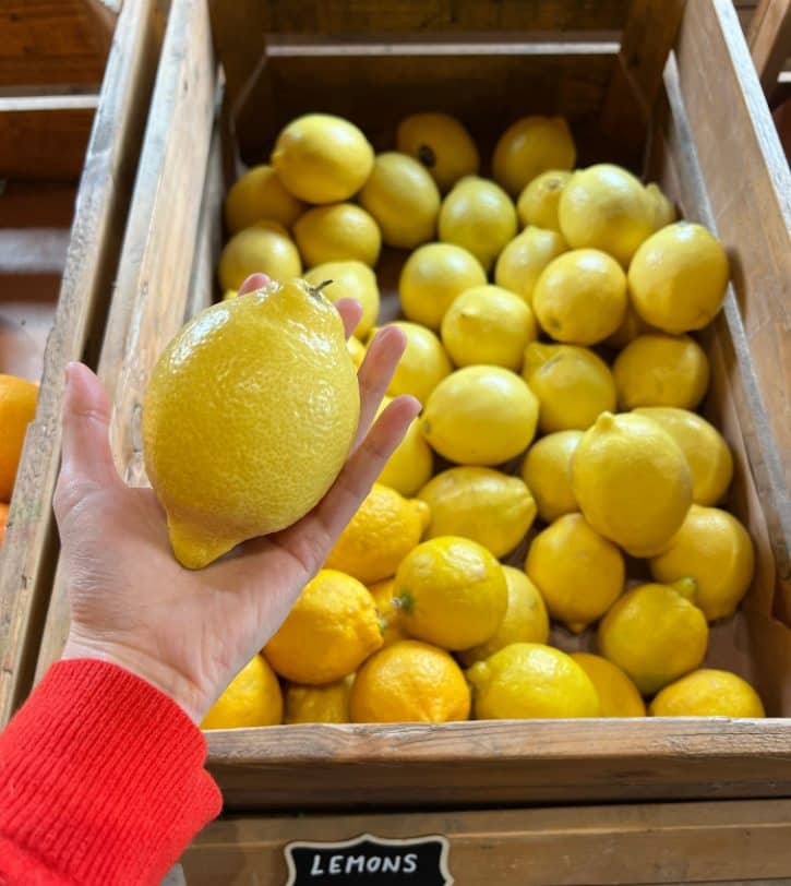 Picking Lemon From Store Display