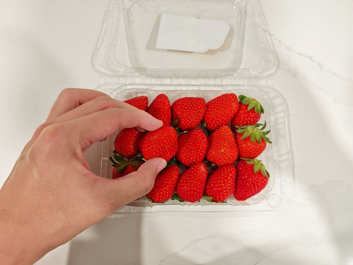 Sorting Fresh Strawberries By Hand