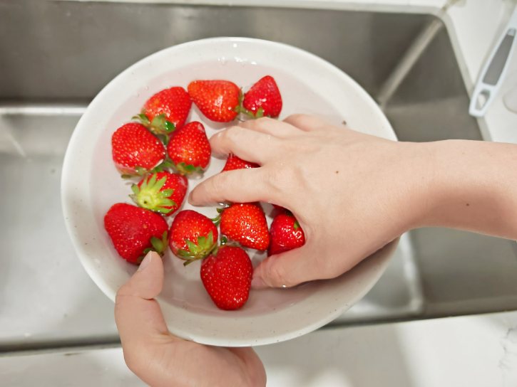 Washing Strawberries In Bowl