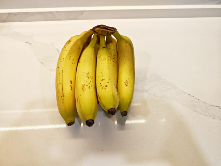 Green Tipped Bananas With Light Spots